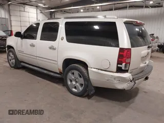 2010 Chevrolet Suburban LTZ with VIN 1GNUKKE31AR290571, listed as a IAAI auction lot 40948006 with 163,758 mi miles. Bid and sale history available at carsss.com. Image 3.