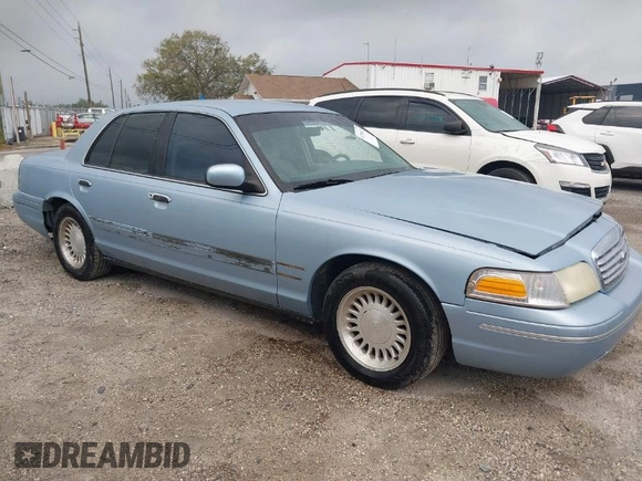 1999 Ford Crown Victoria z VIN 2FAFP73WXXX221069, wystawiony jako IAAI lot #41750127 z przebiegiem 177 142 mil mil oraz . Historia ofert i sprzedaży dostępna na DreamBid. Obrazek 1.