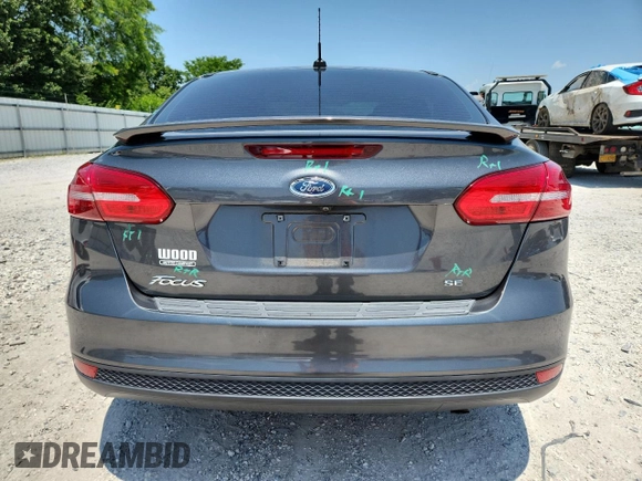 2018 Ford Focus SE with VIN 1FADP3F25JL331038, listed as a Copart auction lot 60235395 with 37,038 mi miles and Salvage title. Bid and sale history available at DreamBid. Image 6.