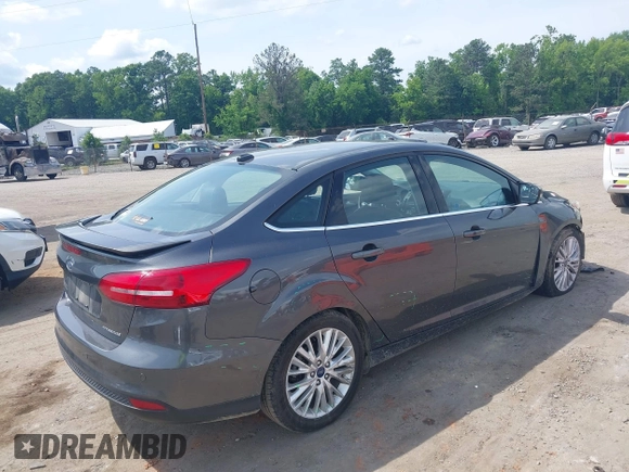 2017 Ford Focus Titanium with VIN 1FADP3J27HL306546, listed as a IAAI auction lot 42480576 with 114,285 mi miles and . Bid and sale history available at DreamBid. Image 4.
