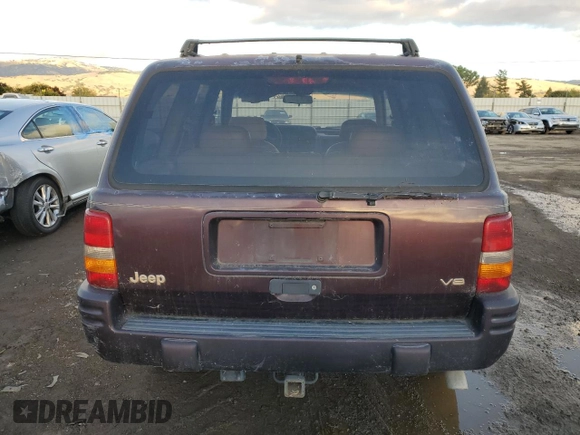 1996 Jeep Grand Cherokee Limited with VIN 1J4GZ78Y3TC182569, listed as a Copart auction lot 80314334 with 302,994 mi miles and Clean Title. Bid and sale history available at carsss.com. Image 6.