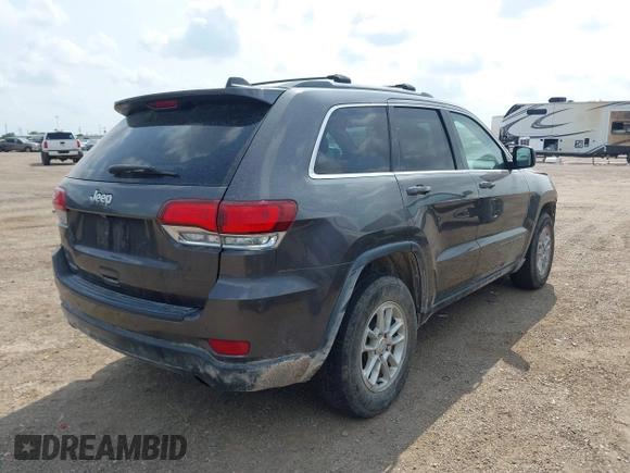 2020 Jeep Grand Cherokee Laredo E with VIN 1C4RJEAG2LC284912, listed as a IAAI auction lot 42114881 with 86,579 mi miles and . Bid and sale history available at DreamBid. Image 4.