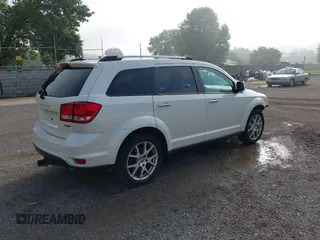 2013 Dodge Journey Crew with VIN 3C4PDCDG0DT591533, listed as a IAAI auction lot 42630548 with 164,961 mi miles and . Bid and sale history available at DreamBid. Image 4.