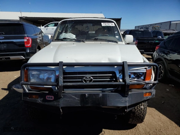 1997 Toyota Land Cruiser with VIN JT3HJ85J2V0180979, listed as a Copart auction lot 73216714 with 239,444 mi miles and Salvage Title. Bid and sale history available at carsss.com. Image 5.