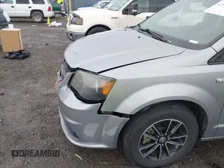 2014 Dodge Grand Caravan SXT with VIN 2C4RDGCG3ER451465, listed as a IAAI auction lot 42111958 with 176,707 mi miles and . Bid and sale history available at DreamBid. Image 6.