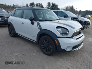 2015 MINI Cooper Countryman S with VIN WMWZC5C58FWP44838, listed as a IAAI auction lot 41281074 with 74,669 mi miles. Bid and sale history available at carsss.com. Image 1.