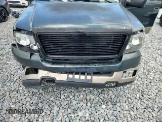 2004 Ford F-150 XL with VIN 1FTPX12564NA87792, listed as a Copart auction lot 60489655 with 396,269 mi miles and Salvage title. Bid and sale history available at DreamBid. Image 11.