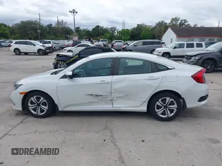 2020 Honda Civic LX with VIN 2HGFC2F69LH521681, listed as a IAAI auction lot 41664332 with 37,038 mi miles and . Bid and sale history available at DreamBid. Image 14.