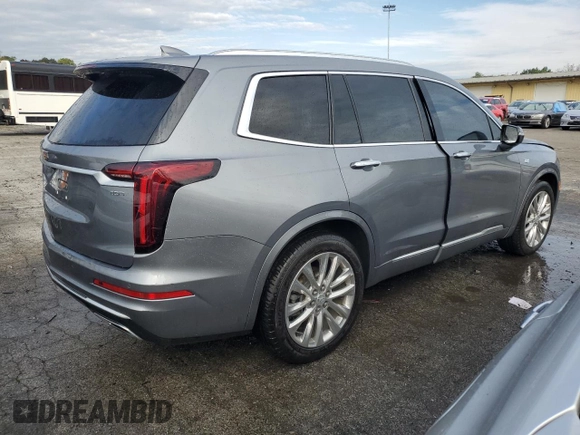 2021 Cadillac XT6 Premium Luxury z VIN 1GYKPDRS6MZ216642, wystawiony jako Copart lot #70779163 z przebiegiem 23 033 mil mil oraz . Historia ofert i sprzedaży dostępna na DreamBid. Obrazek 3.