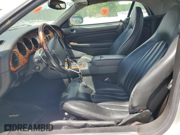 1999 Jaguar XK z VIN SAJGX2049XC034022, wystawiony jako Copart lot #55690025 z przebiegiem Nie podano mil oraz Tytuł czysty. Historia ofert i sprzedaży dostępna na DreamBid. Obrazek 7.