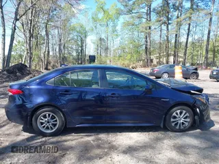 2021 Toyota Corolla Hybrid LE with VIN JTDEAMDE9MJ008582, listed as a IAAI auction lot 41998098 with 113,863 mi miles. Bid and sale history available at carsss.com. Image 12.