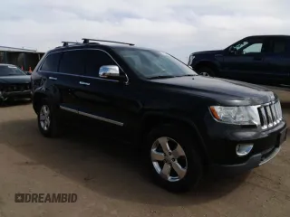2013 Jeep Grand Cherokee Overland with VIN 1C4RJFCG5DC638927, listed as a Copart auction lot 52752615 with 117,494 mi miles and Salvage Title. Bid and sale history available at carsss.com. Image 4.