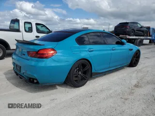 2016 BMW M6 z VIN WBS6E9C51GG437085, wystawiony jako Copart lot #78982124 z przebiegiem Nie podano mil oraz Szkody całkowita. Historia ofert i sprzedaży dostępna na DreamBid. Obrazek 3.
