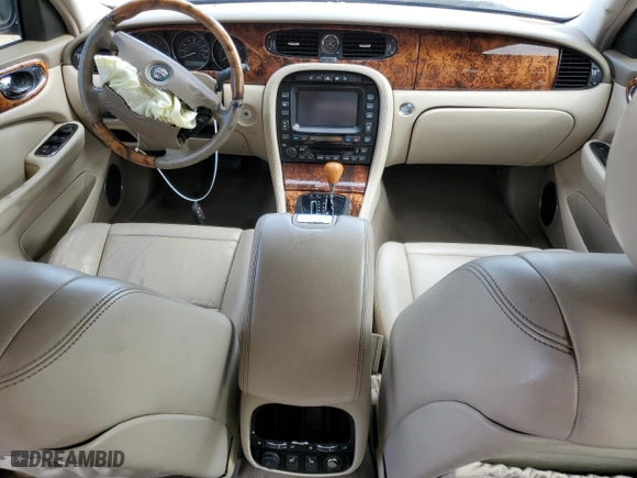 2004 Jaguar XJ with VIN SAJWA71C34SG19800, listed as a Copart auction lot 71877194 with 157,051 mi miles and Salvage Title. Bid and sale history available at carsss.com. Image 8.