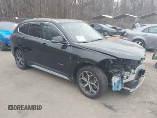 2017 BMW X1 xDrive28i with VIN WBXHT3C31H5F72958, listed as a IAAI auction lot 41782257 with 134,829 mi miles. Bid and sale history available at carsss.com. Image 1.