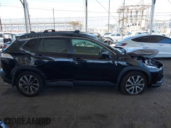 2023 Toyota Corolla Cross XLE with VIN 7MUDAAAG8PV072030, listed as a IAAI auction lot 42397573 with 6,584 mi miles and . Bid and sale history available at DreamBid. Image 12.