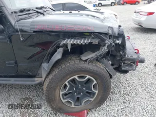 2015 Jeep Wrangler Unlimited Rubicon Hard Rock with VIN 1C4HJWFG6FL757421, listed as a IAAI auction lot 42107514 with 63,997 mi miles and . Bid and sale history available at DreamBid. Image 6.