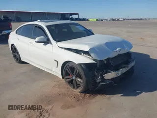 2015 BMW 4 Series 435i with VIN WBA4B1C59FD955497, listed as a IAAI auction lot 41174096 with 101,047 mi miles. Bid and sale history available at carsss.com. Image 1.