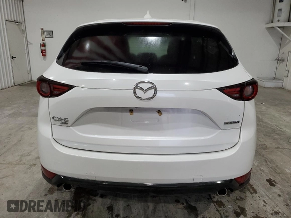 2021 Mazda CX-5 Grand Touring with VIN JM3KFBDM4M1344602, listed as a Copart auction lot 82793724 with 69,322 mi miles and Salvage Title. Bid and sale history available at carsss.com. Image 6.