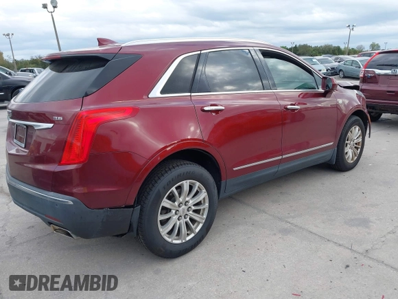 2017 Cadillac XT5 FWD with VIN 1GYKNARS2HZ107587, listed as a IAAI auction lot 41614842 with 124,611 mi miles and . Bid and sale history available at carsss.com. Image 4.