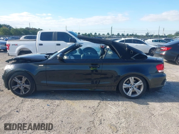 2011 BMW 1 Series 128i with VIN WBAUL7C54BVM80474, listed as a IAAI auction lot 42031032 with 76,617 mi miles and . Bid and sale history available at carsss.com. Image 14.