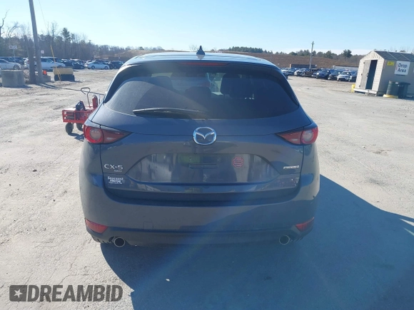 2021 Mazda CX-5 Touring with VIN JM3KFBCM0M0489644, listed as a IAAI auction lot 41756117 with 67,365 mi miles. Bid and sale history available at carsss.com. Image 16.