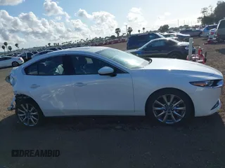 2020 Mazda 3 Premium with VIN 3MZBPAEM3LM132772, listed as a IAAI auction lot 42067269 with 53,751 mi miles and . Bid and sale history available at DreamBid. Image 13.