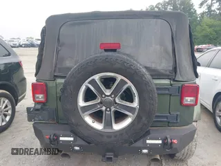 2008 Jeep Wrangler Sahara with VIN 1J4FA54118L653044, listed as a IAAI auction lot 42557244 with 152,072 mi miles and . Bid and sale history available at DreamBid. Image 16.