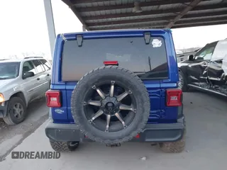 2018 Jeep Wrangler Unlimited Sahara z VIN 1C4HJXEN0JW274942, wystawiony jako IAAI lot #41175231 z przebiegiem 97 255 mil mil oraz . Historia ofert i sprzedaży dostępna na DreamBid. Obrazek 16.