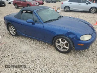 1999 Mazda MX-5 Miata with VIN JM1NB3532X0134801, listed as a Copart auction lot 83838374 with 97,015 mi miles and Salvage title. Bid and sale history available at DreamBid. Image 4.