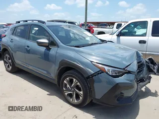 2024 Subaru Crosstrek Premium z VIN JF2GUADCXRH229041, wystawiony jako IAAI lot #42538082 z przebiegiem 21 707 mil mil oraz . Historia ofert i sprzedaży dostępna na DreamBid. Obrazek 1.