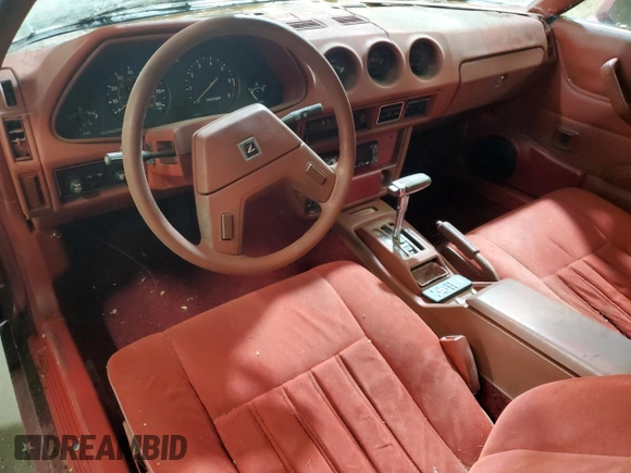 1981 Datsun 280ZX z VIN JN1HZ04S1BX414616, wystawiony jako Copart lot #82249204 z przebiegiem 114 028 mil mil oraz Tytuł czysty. Historia ofert i sprzedaży dostępna na DreamBid. Obrazek 8.