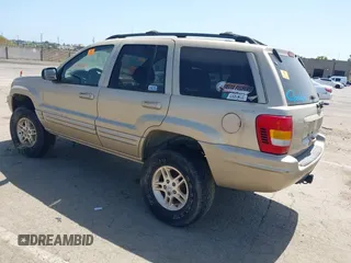 1999 Jeep Grand Cherokee Limited with VIN 1J4GW68N2XC654713, listed as a IAAI auction lot 42115829 with 195,988 mi miles. Bid and sale history available at carsss.com. Image 3.