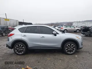 2016 Mazda CX-5 Grand Touring with VIN JM3KE4DY4G0712465, listed as a IAAI auction lot 41859217 with 61,806 mi miles and . Bid and sale history available at carsss.com. Image 14.