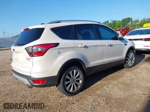 2017 Ford Escape Titanium with VIN 1FMCU0J90HUC51244, listed as a IAAI auction lot 42206165 with 106,847 mi miles and . Bid and sale history available at DreamBid. Image 4.