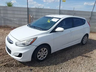 2014 Hyundai Accent GS with VIN KMHCT5AE6EU157751, listed as a IAAI auction lot 42161112 with 145,653 mi miles. Bid and sale history available at carsss.com. Image 2.