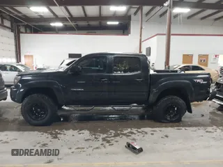 2009 Toyota Tacoma with VIN 3TMLU42N79M027885, listed as a IAAI auction lot 41146330 with 261,832 mi miles and . Bid and sale history available at DreamBid. Image 14.