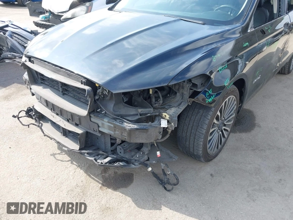 2018 Ford Fusion Titanium with VIN 3FA6P0RU6JR115236, listed as a IAAI auction lot 42111343 with 106,858 mi miles and . Bid and sale history available at DreamBid. Image 6.
