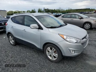 2013 Hyundai Tucson GLS with VIN KM8JU3AC1DU709937, listed as a Copart auction lot 52716295 with 181,711 mi miles and Salvage Title. Bid and sale history available at carsss.com. Image 4.