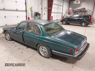 1985 Jaguar XJ with VIN SAJAV1347FC414864, listed as a IAAI auction lot 42118511 with 117,185 mi miles and . Bid and sale history available at DreamBid. Image 3.