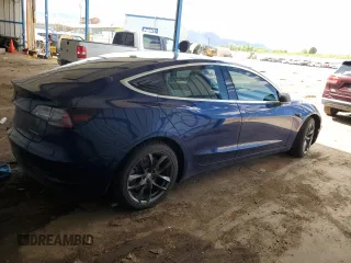 2018 Tesla Model 3 Long Range Battery z VIN 5YJ3E1EB3JF134664, wystawiony jako Copart lot #57288485 z przebiegiem Nie podano mil oraz Szkoda całkowita • Salvage title. Historia ofert i sprzedaży dostępna na DreamBid. Obrazek 3.
