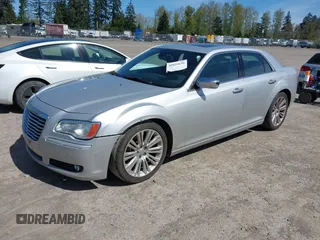 2012 Chrysler 300 with VIN 2C3CCAET2CH207796, listed as a IAAI auction lot 42029639 with 142,929 mi miles. Bid and sale history available at carsss.com. Image 2.