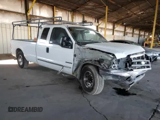1999 Ford F-250 XL with VIN 1FTNX20FXXEE59499, listed as a Copart auction lot 87511735 with 215,520 mi miles and Salvage title. Bid and sale history available at DreamBid. Image 4.