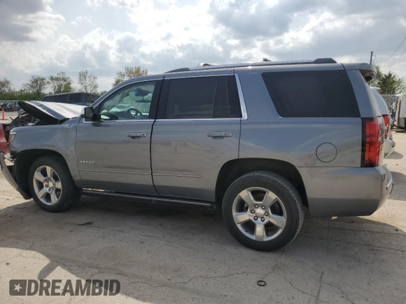2020 Chevrolet Tahoe Premier with VIN 1GNSKCKC7LR125399, listed as a Copart auction lot 54702635 with 134,684 mi miles and Salvage title. Bid and sale history available at DreamBid. Image 2.