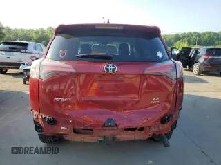 2018 Toyota RAV4 LE with VIN 2T3BFREV7JW723938, listed as a Copart auction lot 62814195 with 107,051 mi miles and Salvage title. Bid and sale history available at DreamBid. Image 6.