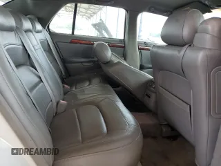 2004 Cadillac DeVille DTS z VIN 1G6KF57924U185324, wystawiony jako Copart lot #58222205 z przebiegiem 182 640 mil mil oraz Szkoda całkowita • Salvage title. Historia ofert i sprzedaży dostępna na DreamBid. Obrazek 10.