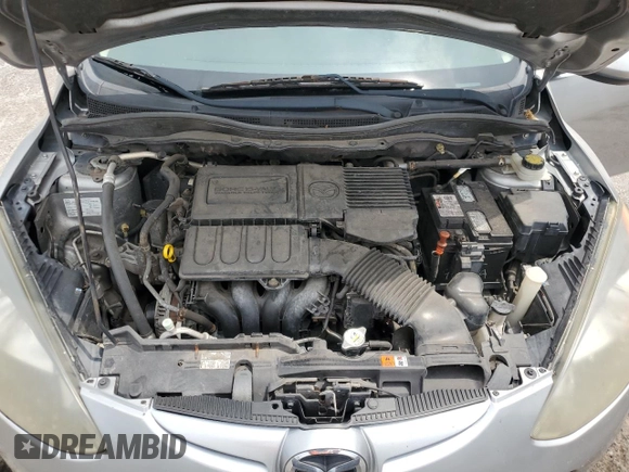 2013 Mazda 2 Touring z VIN JM1DE1LZ5D0162425, wystawiony jako Copart lot #59033595 z przebiegiem 225 932 mil mil oraz Szkoda całkowita • Salvage title. Historia ofert i sprzedaży dostępna na DreamBid. Obrazek 11.
