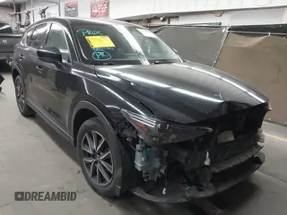 2018 Mazda CX-5 Grand Touring z VIN JM3KFADMXJ0311101, wystawiony jako IAAI lot #42163070 z przebiegiem 129 284 mil mil oraz . Historia ofert i sprzedaży dostępna na DreamBid. Obrazek 1.