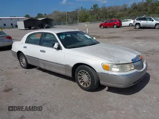 2001 Lincoln Town Car Signature with VIN 1LNHM82W21Y630415, listed as a IAAI auction lot 41615167 with 235,665 mi miles and . Bid and sale history available at DreamBid. Image 1.