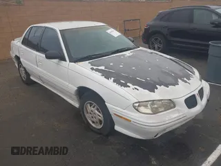 1998 Pontiac Grand Am SE2 with VIN 1G2NE52T7WM513702, listed as a IAAI auction lot 41503141 with 302,315 mi miles. Bid and sale history available at carsss.com. Image 1.